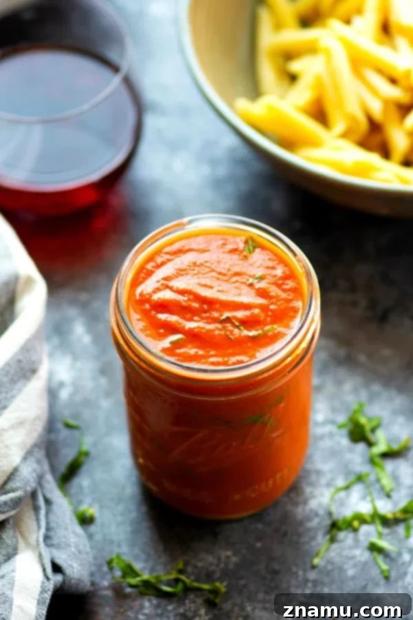 Effortless Red Wine Pasta Sauce 5 Freshly blended red wine pasta sauce poured into a serving bowl, ready to be tossed with pasta.