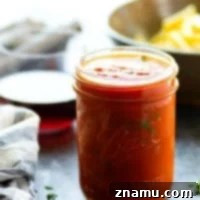 Rich red wine pasta sauce in a jar, ready for storage or serving.