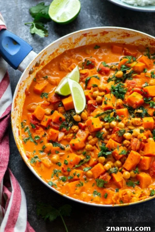 Red Thai sweet potato chickpea curry in a creamy spicy coconut sauce is loaded with hearty vegetables and an incredible vegetarian take on curry!
