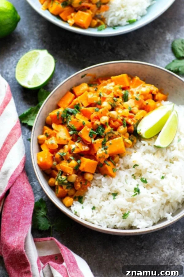 Red Thai sweet potato chickpea curry in a creamy spicy coconut sauce is loaded with hearty vegetables and an incredible vegetarian take on curry!