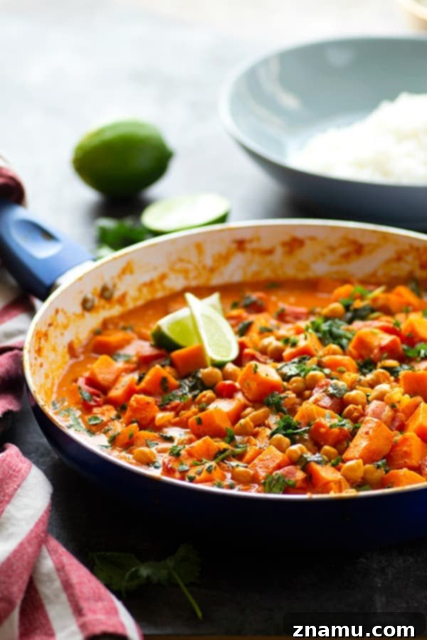 Red Thai sweet potato chickpea curry in a creamy spicy coconut sauce is loaded with hearty vegetables and an incredible vegetarian take on curry!