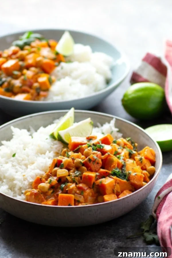 Red Thai sweet potato chickpea curry in a creamy spicy coconut sauce is loaded with hearty vegetables and an incredible vegetarian take on curry!