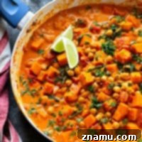 Red Thai sweet potato chickpea curry in a creamy spicy coconut sauce is loaded with hearty vegetables and an incredible vegetarian take on curry!
