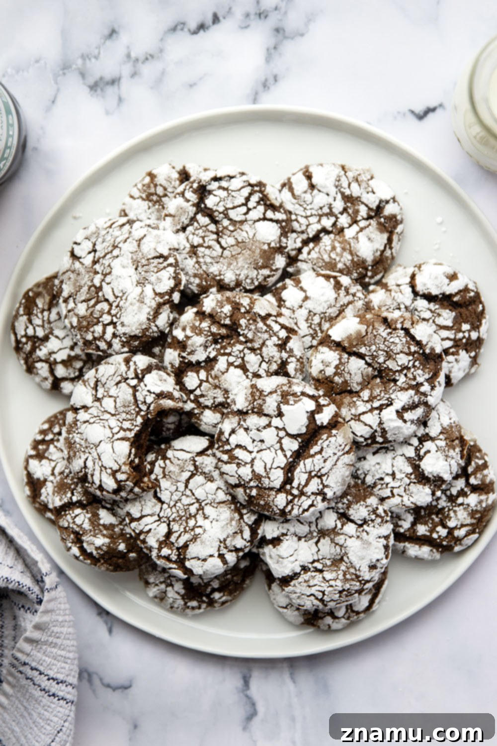Deep Chocolate Molasses Crinkles 6 Plate of perfectly baked chocolate molasses crinkle cookies, ready to be served.