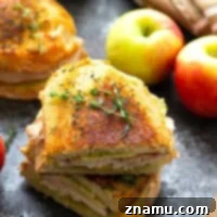 Turkey panini is layered with hearty turkey slices, crunchy apples, flavorful pesto, and gooey gouda cheese for one showstopper sandwich! -- this is the perfect panini for turkey leftovers!