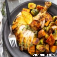 Roasted with a ginger orange butter and served with tender sweet potatoes and brussels sprouts, this orange roast chicken is a simple, yet impressive way to make roast chicken for a holiday dinner!