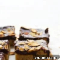 Decadent Chocolate Ganache Almond Sugar Cookie Bars 7 Covered in a rich layer of homemade chocolate ganache, these buttery almond sugar cookie bars are a stunning addition to any cookie tray and SO easy to make!