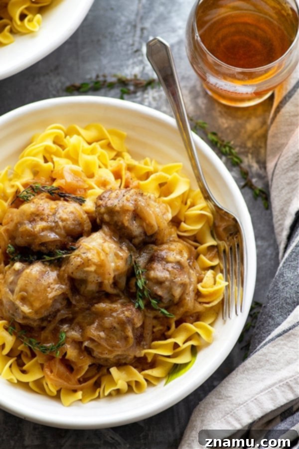Flavorful French Onion Soup Meatballs, cooked entirely in the Instant Pot, with rich beer and gooey Swiss cheese.