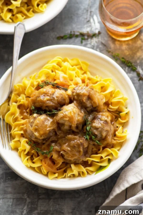 Ingredients for Instant Pot French Onion Soup Meatballs laid out: ground beef, onions, beer, broth, Swiss cheese, and seasonings.