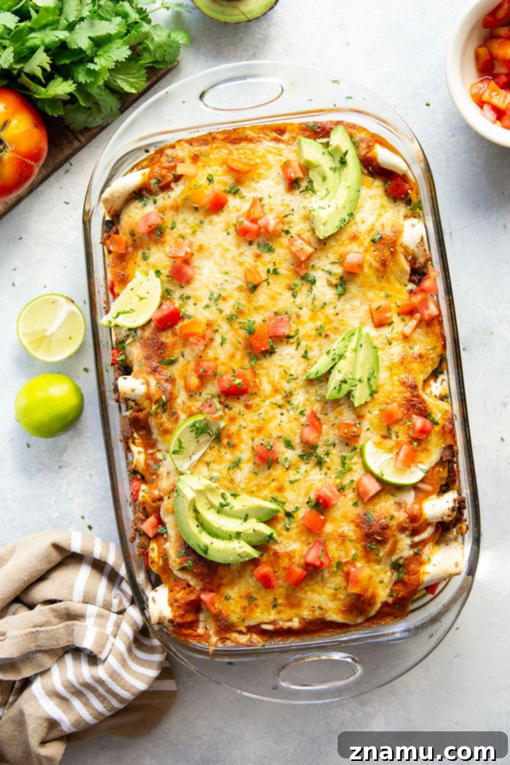 Golden Pumpkin Enchiladas 4 Individual pumpkin enchilada cut open, showing the rich beef and black bean filling inside.
