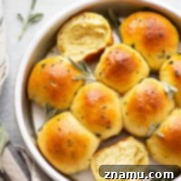 Soft Milk Bread Rolls with Honey Sage Butter 7 Japanese Milk Bread Rolls with Honey Sage Butter, showcasing the final baked product.
