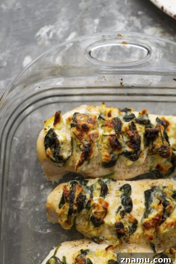 Triple Cheese Spinach Artichoke Hasselback Chicken 2 Stuffed with three different cheeses and a garlicky spinach artichoke filling, this hasselback chicken is a breeze to whip up and the perfect way to elevate chicken breasts for dinner!