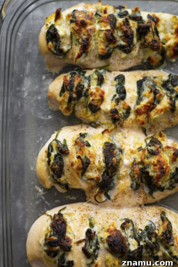 Triple Cheese Spinach Artichoke Hasselback Chicken 3 Stuffed with three different cheeses and a garlicky spinach artichoke filling, this hasselback chicken is a breeze to whip up and the perfect way to elevate chicken breasts for dinner!