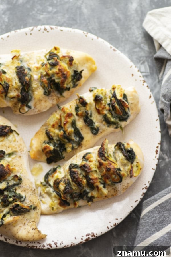 Triple Cheese Spinach Artichoke Hasselback Chicken 4 Stuffed with three different cheeses and a garlicky spinach artichoke filling, this hasselback chicken is a breeze to whip up and the perfect way to elevate chicken breasts for dinner!