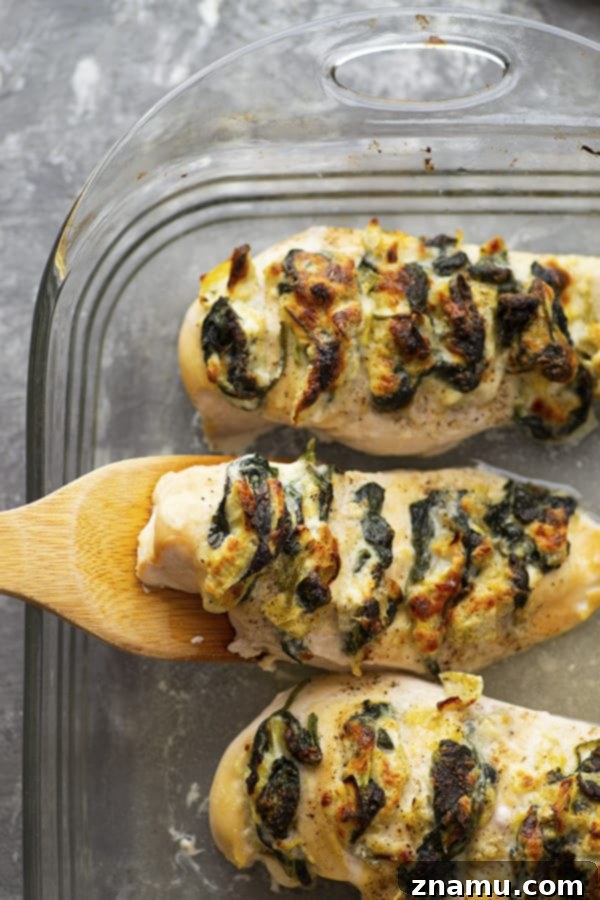Triple Cheese Spinach Artichoke Hasselback Chicken 5 Stuffed with three different cheeses and a garlicky spinach artichoke filling, this hasselback chicken is a breeze to whip up and the perfect way to elevate chicken breasts for dinner!