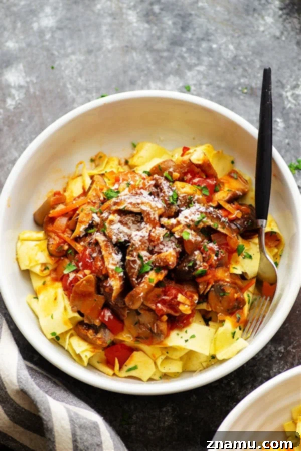 Rich shiitake mushroom ragu with garlic butter pappardelle noodles, a cozy vegetarian dinner