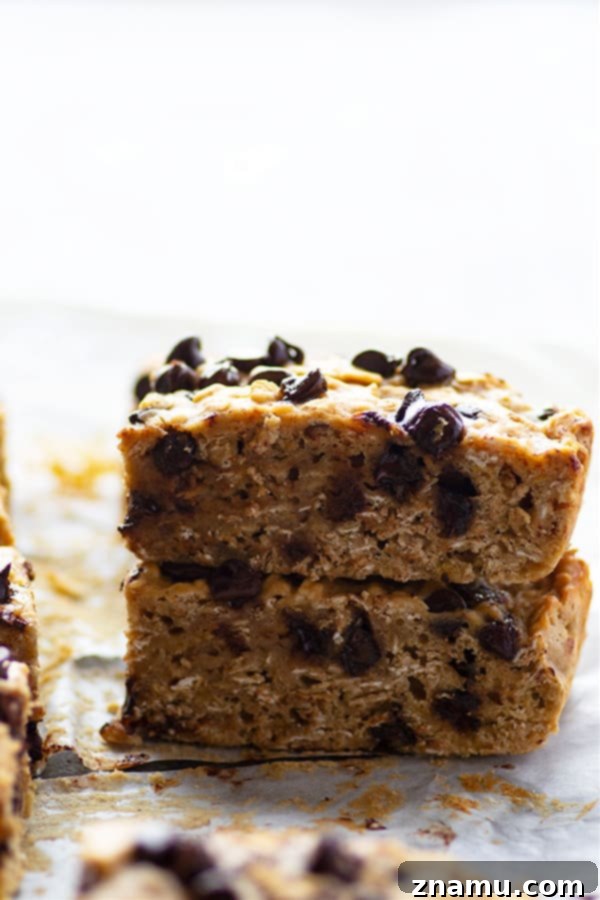 Delightful banana chocolate chip oatmeal breakfast bars, perfect for a grab-and-go breakfast, make-ahead, or freezing.
