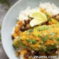 Baked in a fresh homemade salsa verde and flavorful sweet pepper black beans, this salsa verde chicken is ready in under an hour and fantastic served over hot rice!