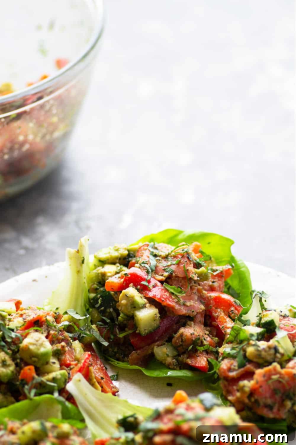 Smoked salmon lettuce wraps featuring a fresh smoked salmon and veggie filling with garlic walnut pesto, ideal for easy meal prep.