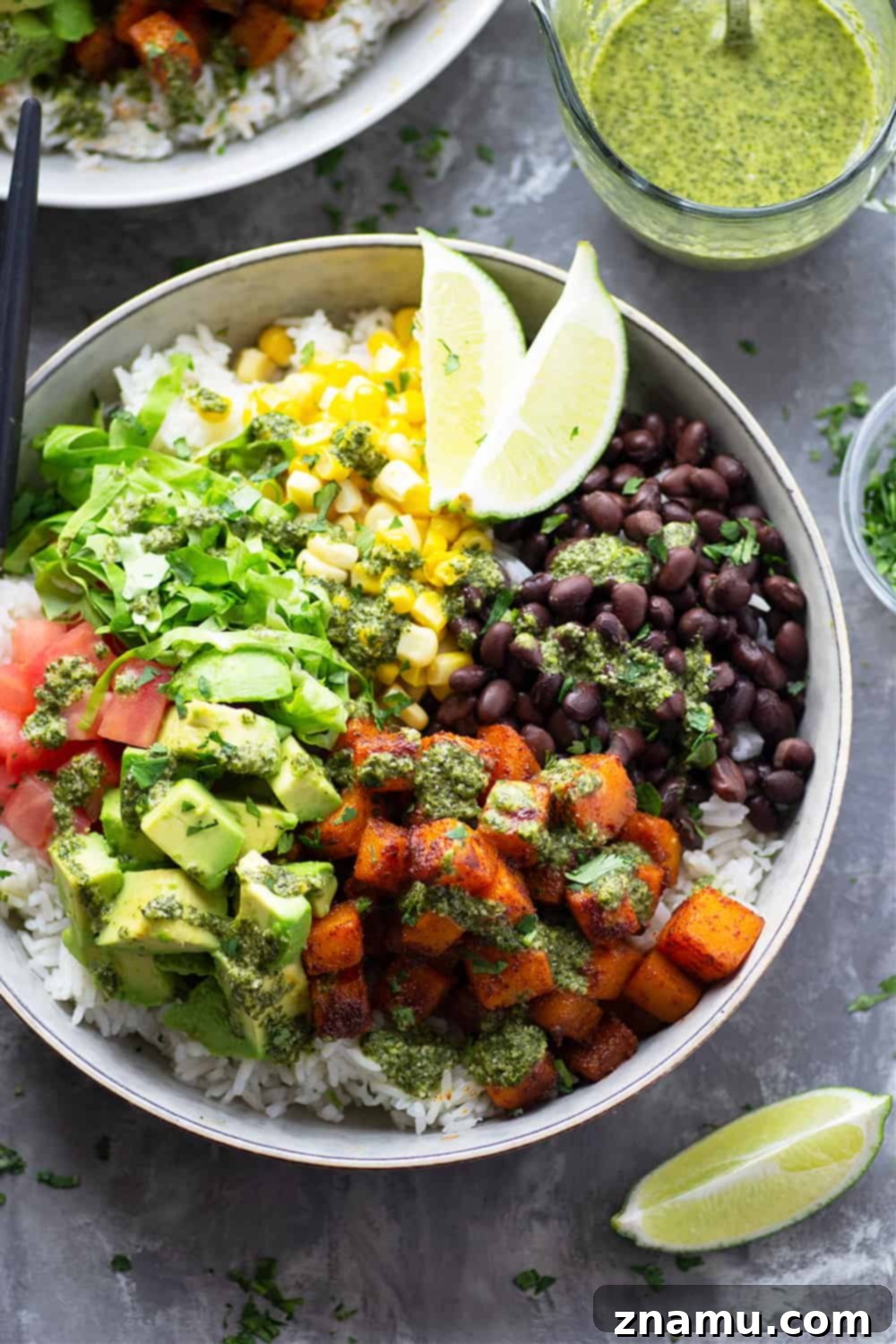 Smoky Butternut Burrito Bowls with Zesty Mojo 5 Blackened butternut squash burrito bowls are piled high with all the fixins' and a flavorful fresh mojo sauce for a healthy take on burrito bowls! Completely vegetarian AND vegan!