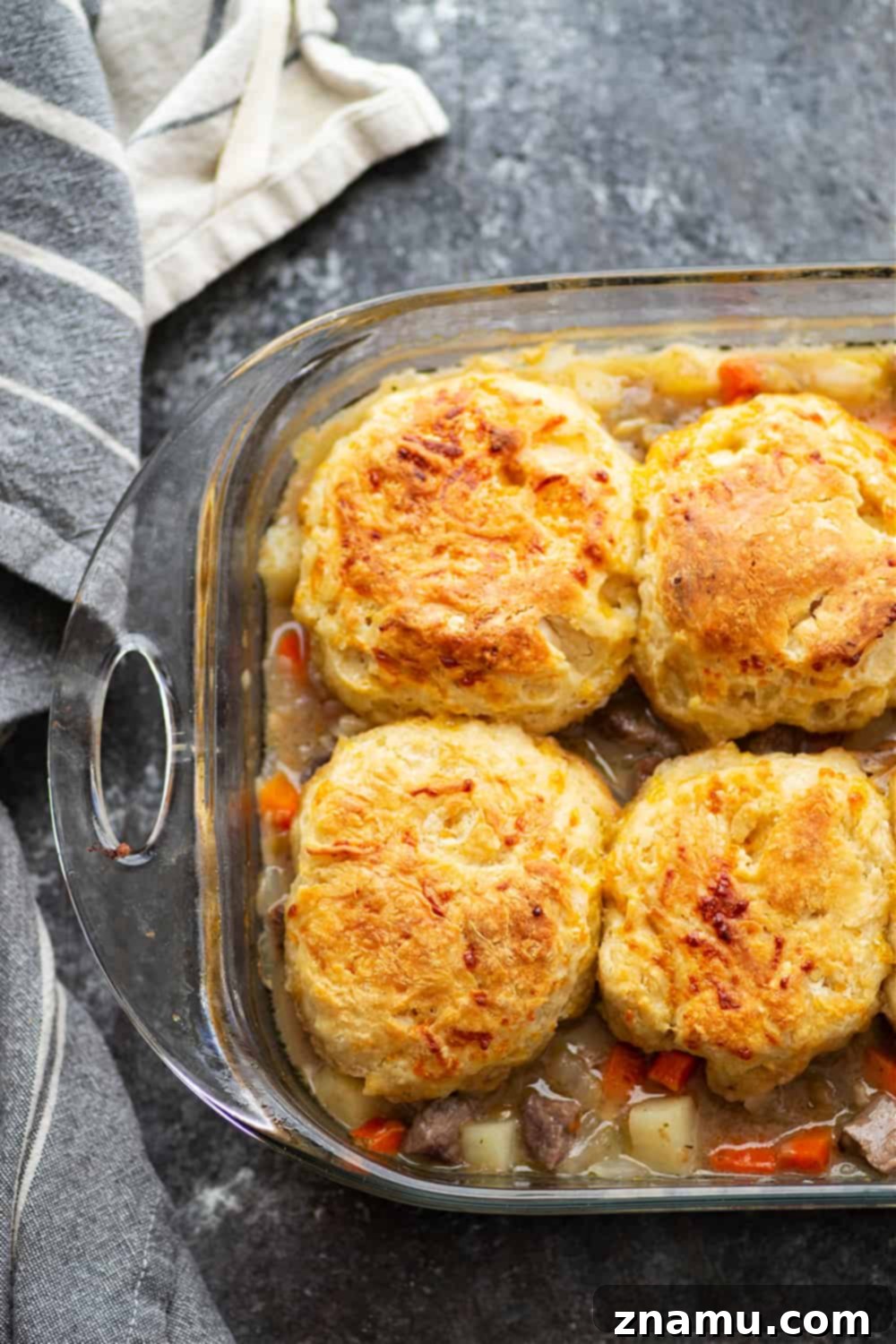 Savory Steak Pie with Cheddar Biscuit Crust 3 Loaded with steak and potatoes in a rich beer sauce and topped with buttery cheddar biscuits, this steak pot pie is an irresistible weeknight comfort food!