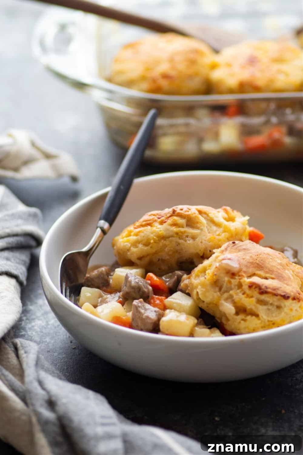 Savory Steak Pie with Cheddar Biscuit Crust 4 Loaded with steak and potatoes in a rich beer sauce and topped with buttery cheddar biscuits, this steak pot pie is an irresistible weeknight comfort food!