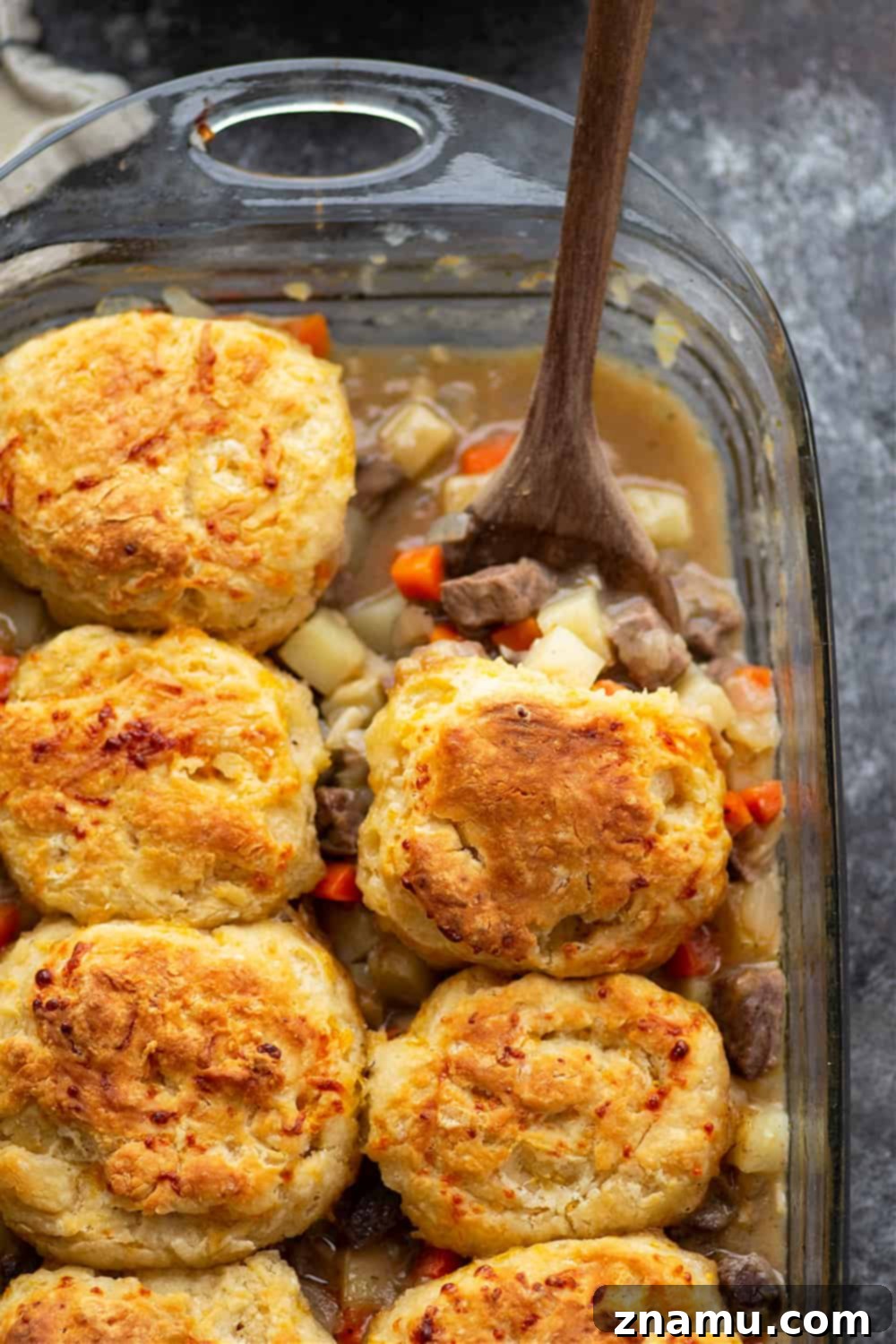 Savory Steak Pie with Cheddar Biscuit Crust 5 Loaded with steak and potatoes in a rich beer sauce and topped with buttery cheddar biscuits, this steak pot pie is an irresistible weeknight comfort food!