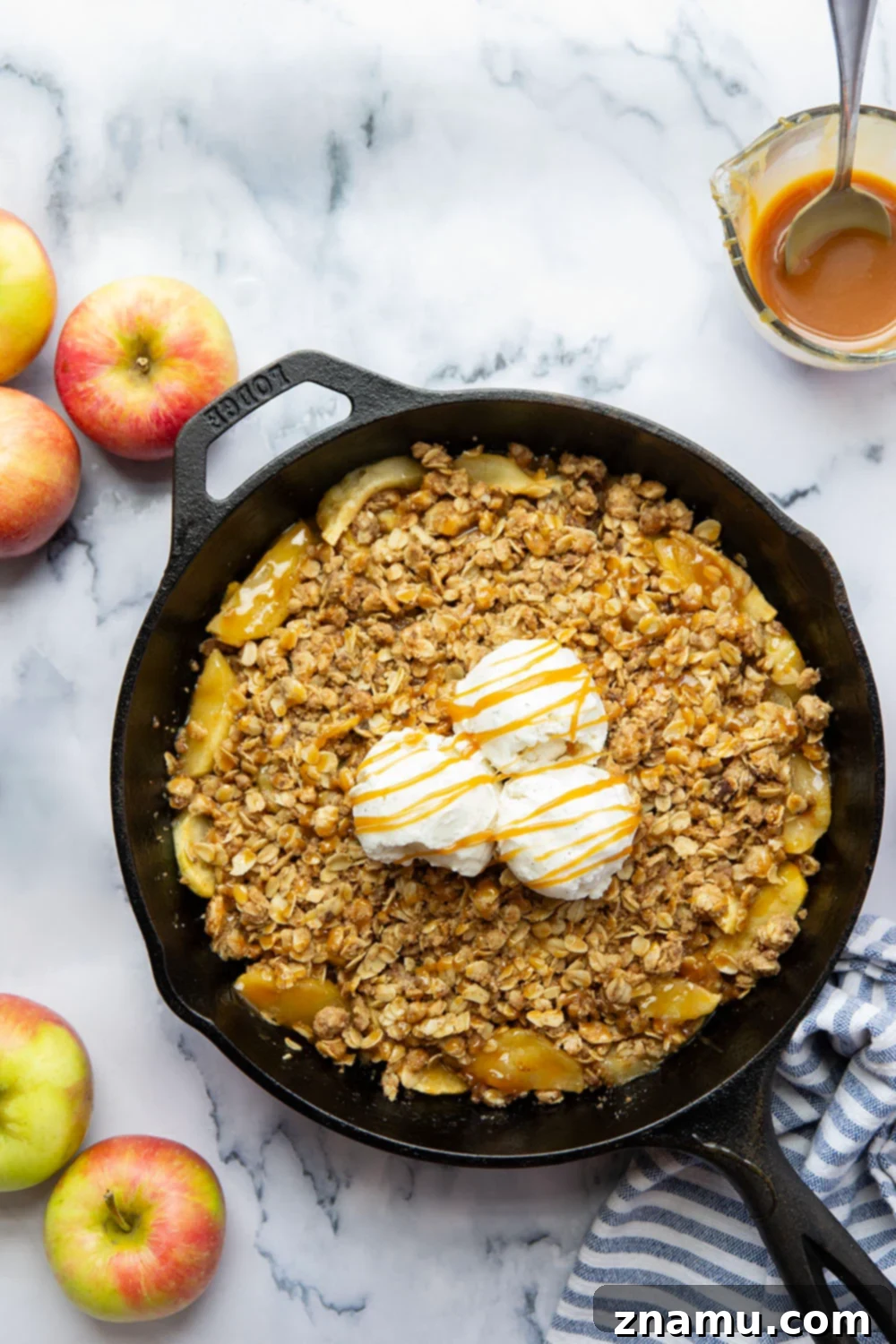 Gooey Skillet Caramel Apple Crisp 4 Ingredients for Skillet Caramel Apple Crisp laid out on a kitchen counter, including apples, oats, flour, and spices.