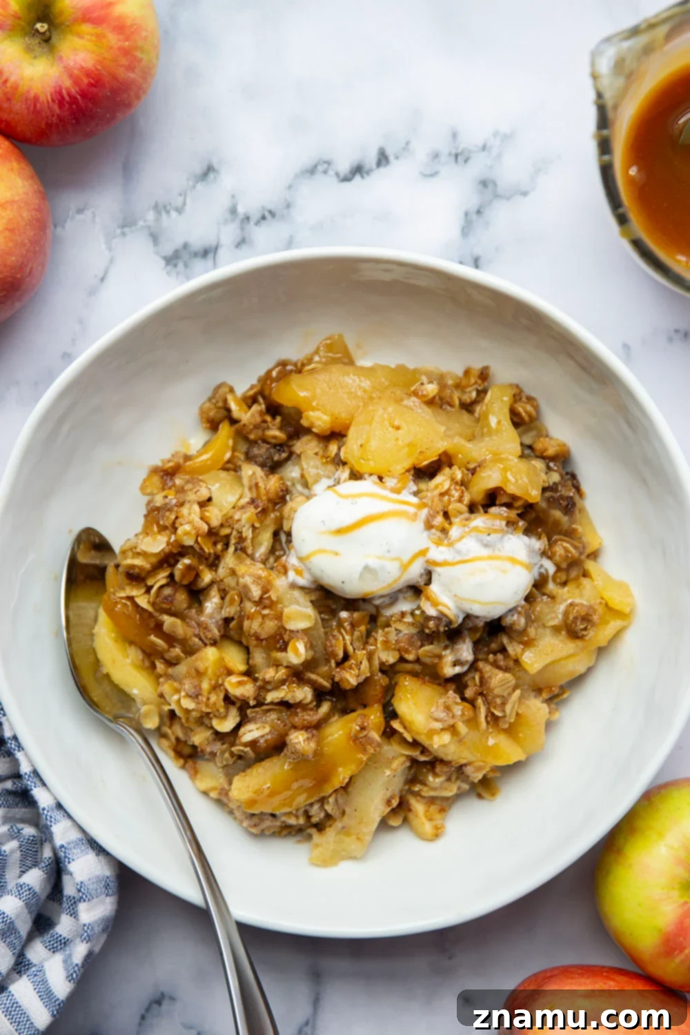 Gooey Skillet Caramel Apple Crisp 6 A top-down view of the Skillet Caramel Apple Crisp, showcasing its golden brown streusel and rich caramel sauce.