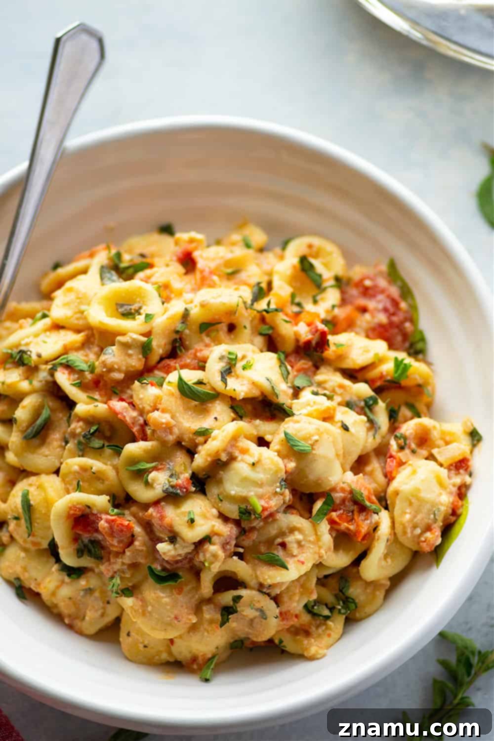 Effortless Feta Pasta Bake 2 Baked feta and herby bursting cherry tomatoes cook down into the most luxurious creamy sauce EVER for pasta! Inspired from the viral TikTok recipe, this baked feta pasta will quickly become a dinner regular!