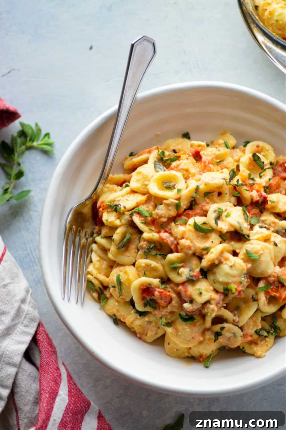 Effortless Feta Pasta Bake 4 Baked feta and herby bursting cherry tomatoes cook down into the most luxurious creamy sauce EVER for pasta! Inspired from the viral TikTok recipe, this baked feta pasta will quickly become a dinner regular!