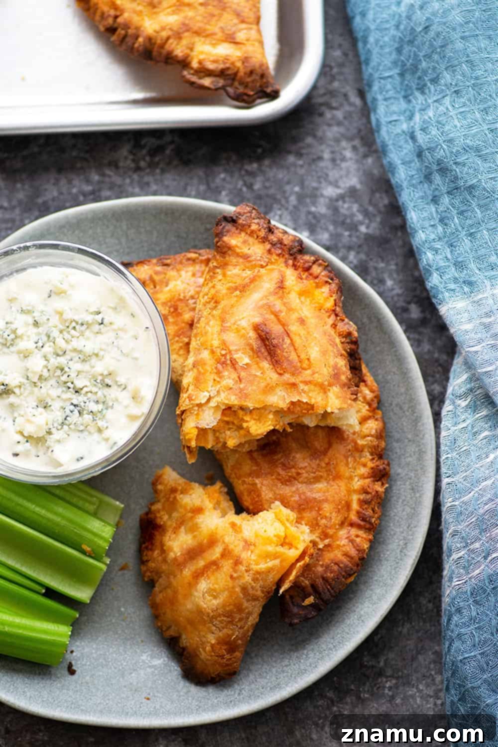 Crispy Air-Fried Buffalo Chicken Empanadas 5 A plate of crispy homemade Buffalo Chicken Empanadas, fresh from the air fryer.