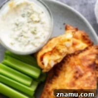 Crispy Air-Fried Buffalo Chicken Empanadas 7 Delicious and crispy Air Fryer Buffalo Chicken Empanadas, a perfect game day snack.
