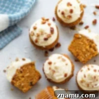 Coconut carrot cake cupcakes feature an incredibly soft browned butter carrot cake interior with plenty of toasty nuts, flaked coconut, and a silky cream cheese frosting.