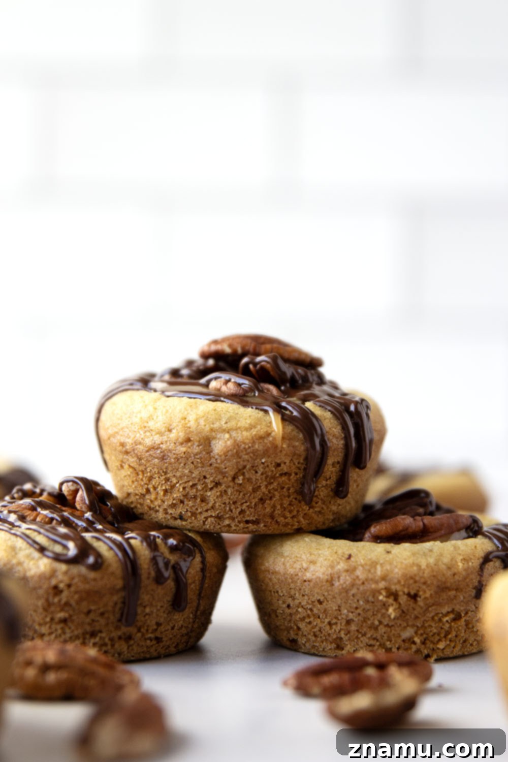 Decadent Turtle Cookie Cups 4 These soft and chewy turtle cookie cups feature a soft butter cookie cup filled with toasted pecans, salted caramel, and a luscious drizzle of melted chocolate.