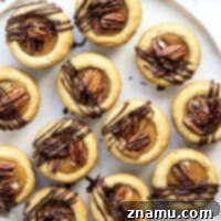 Decadent Turtle Cookie Cups 8 These soft and chewy turtle cookie cups feature a soft butter cookie cup filled with toasted pecans, salted caramel, and a luscious drizzle of melted chocolate.