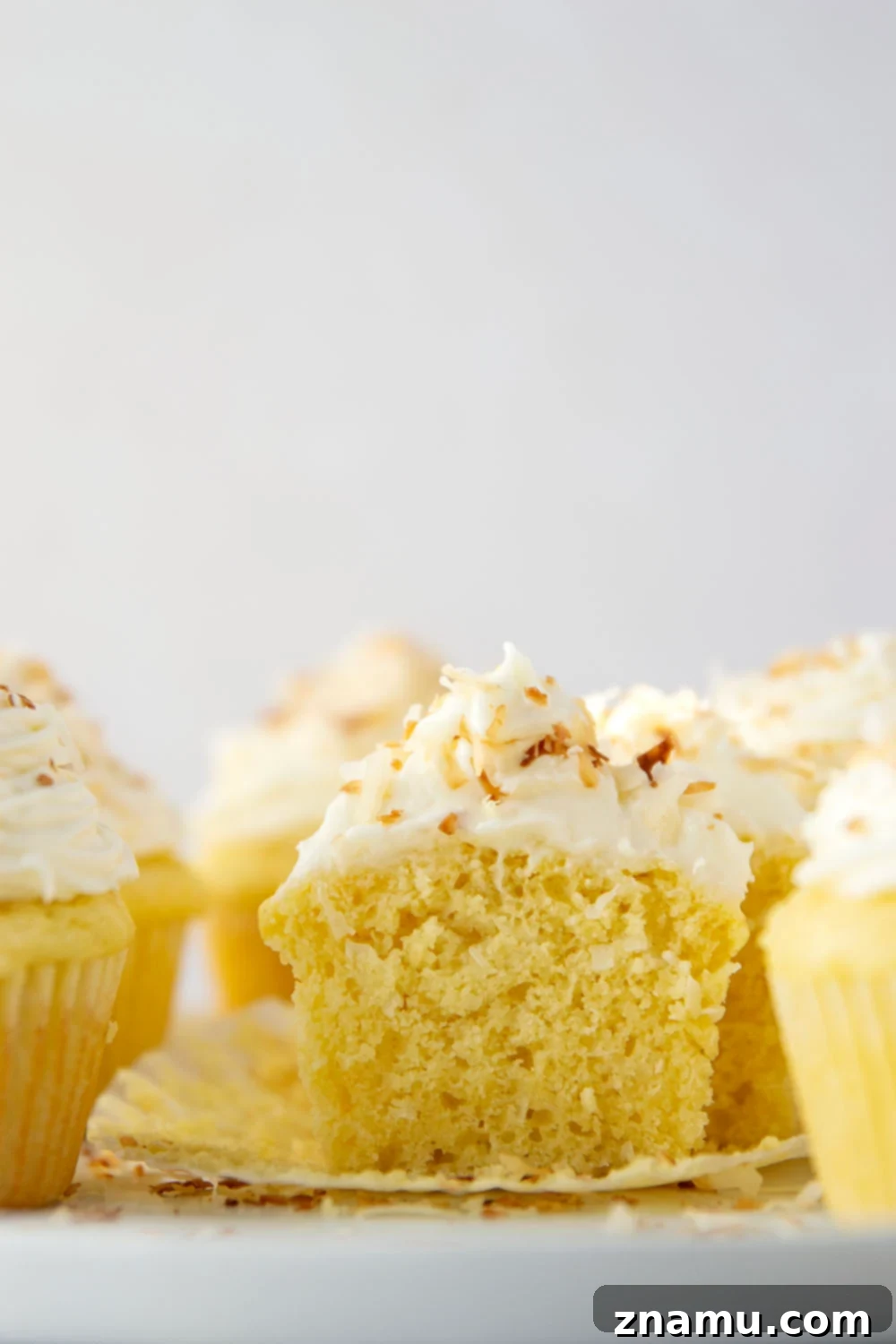 Heavenly Coconut Cupcakes with Cream Cheese Frosting 5 Ingredient shot of softened butter, eggs, and buttermilk for coconut cupcakes