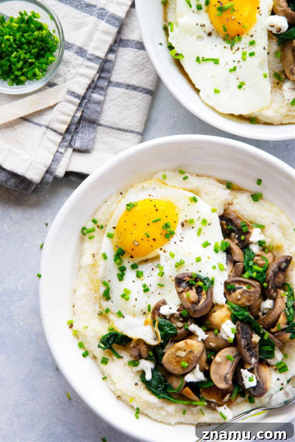 Creamy Goat Cheese Grits, Garlicky Mushrooms, and Fresh Spinach 3 Homemade goat cheese grits are incredibly creamy and served with garlic butter mushrooms and spinach on the side and beautiful fried eggs on top for a hearty breakfast!
