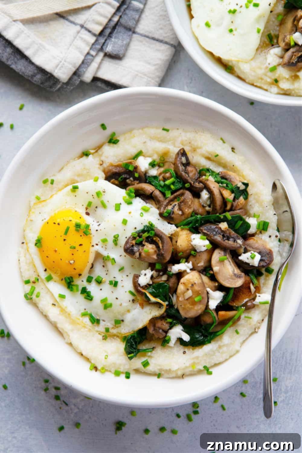 Creamy Goat Cheese Grits, Garlicky Mushrooms, and Fresh Spinach 4 Homemade goat cheese grits are incredibly creamy and served with garlic butter mushrooms and spinach on the side and beautiful fried eggs on top for a hearty breakfast!