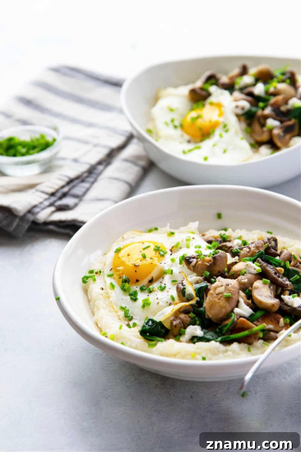 Creamy Goat Cheese Grits, Garlicky Mushrooms, and Fresh Spinach 6 Homemade goat cheese grits are incredibly creamy and served with garlic butter mushrooms and spinach on the side and beautiful fried eggs on top for a hearty breakfast!