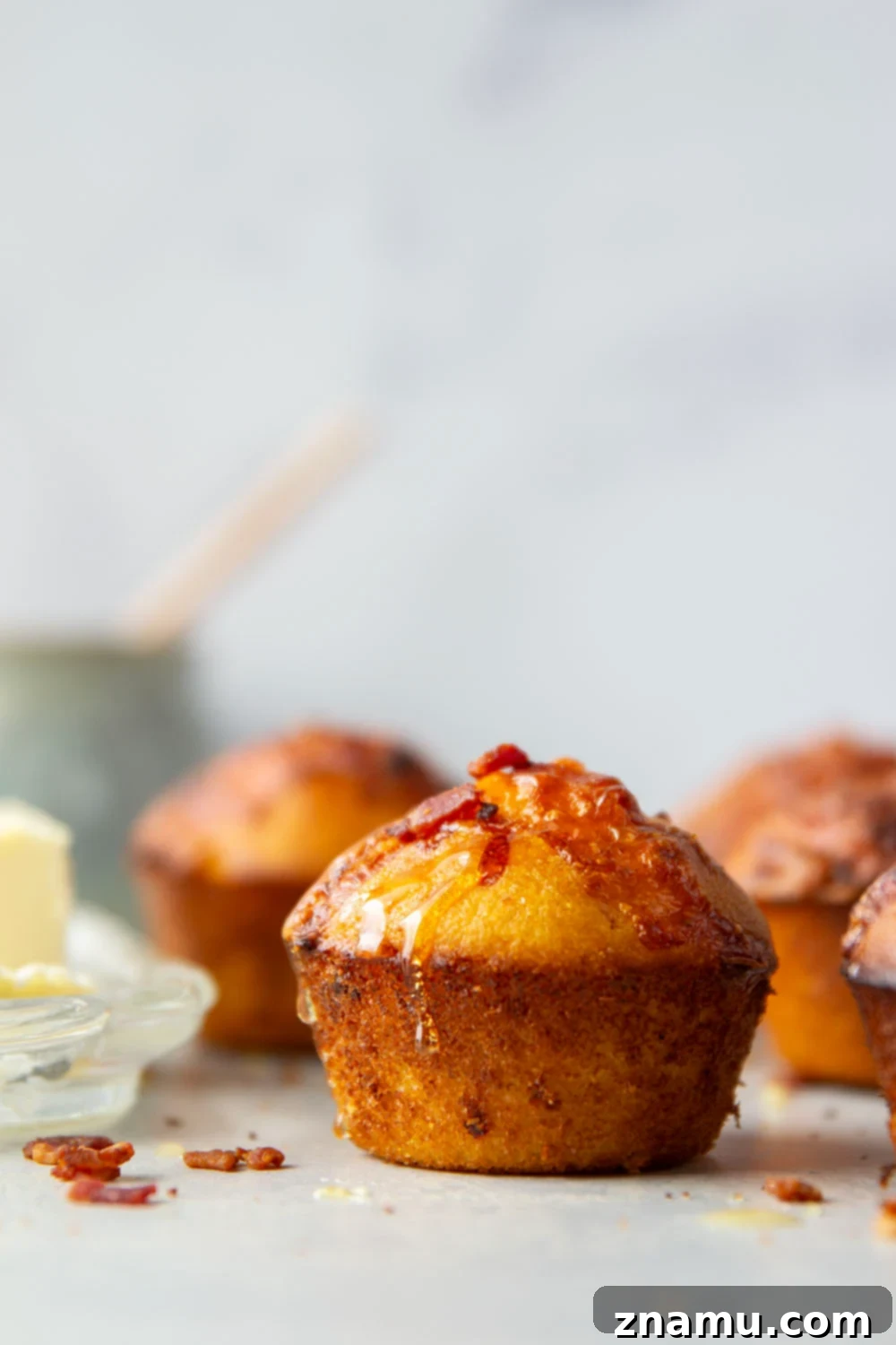 Loaded Bacon Cheddar Cornbread Muffins 2 Fluffy Bacon Cheddar Cornbread Muffins bursting with rich cheese and crispy bacon