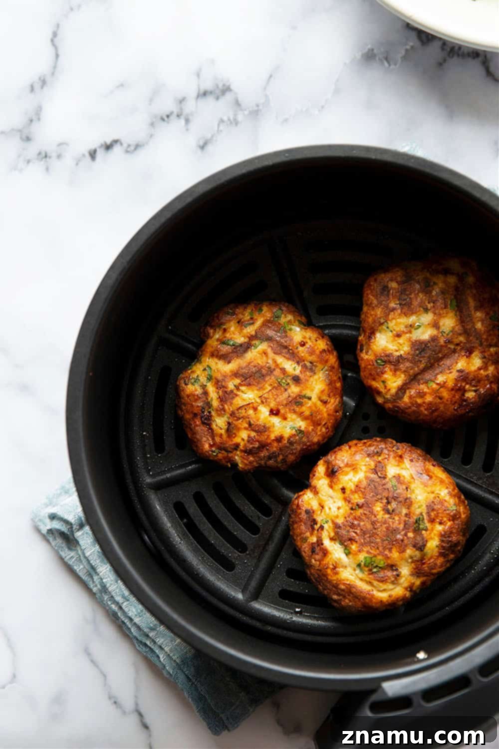 Crispy Air-Fried Salmon Cakes with Zesty Tahini Slaw 3 Air fryer salmon patties are perfectly juicy and use fresh salmon for the best flavor! Pile these salmon patties in a soft bun with lots of flavorful tahini slaw.