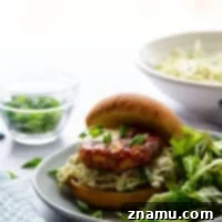 Air fryer salmon patties are perfectly juicy and use fresh salmon for the best flavor! Pile these salmon patties in a soft bun with lots of flavorful tahini slaw.