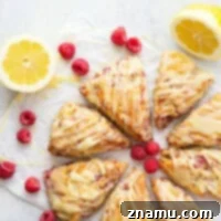 Zesty Lemon Raspberry Scones with Sweet White Chocolate Glaze 7 Perfectly flaky and loaded with juicy raspberries and tangy lemon flavor, these lemon raspberry scones are glazed in a rich white chocolate glaze and a beautiful addition to any brunch!