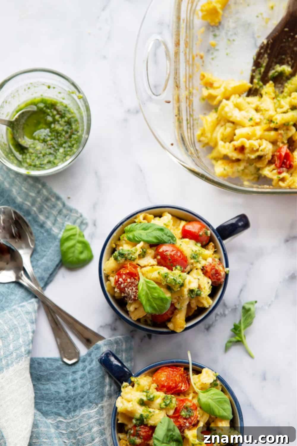 Vibrant Macaroni and Cheese: Bursting Tomatoes & Aromatic Basil Pesto 2 Baked Bursting Tomato Macaroni and Cheese with vibrant basil pesto and juicy roasted cherry tomatoes, a perfect summer comfort food.