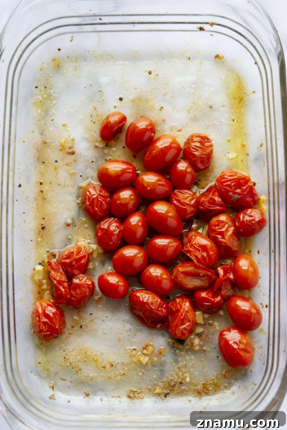 Vibrant Macaroni and Cheese: Bursting Tomatoes & Aromatic Basil Pesto 4 Ingredients for Bursting Tomato Macaroni and Cheese laid out on a table: cherry tomatoes, fresh basil, pasta, and cheese.