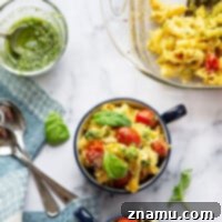 Vibrant Macaroni and Cheese: Bursting Tomatoes & Aromatic Basil Pesto 8 Baked with juicy bursting cherry tomatoes and swirled with fresh basil pesto, this bursting tomato macaroni and cheese is exploding with fresh flavors and impossible to only have one bowl of!