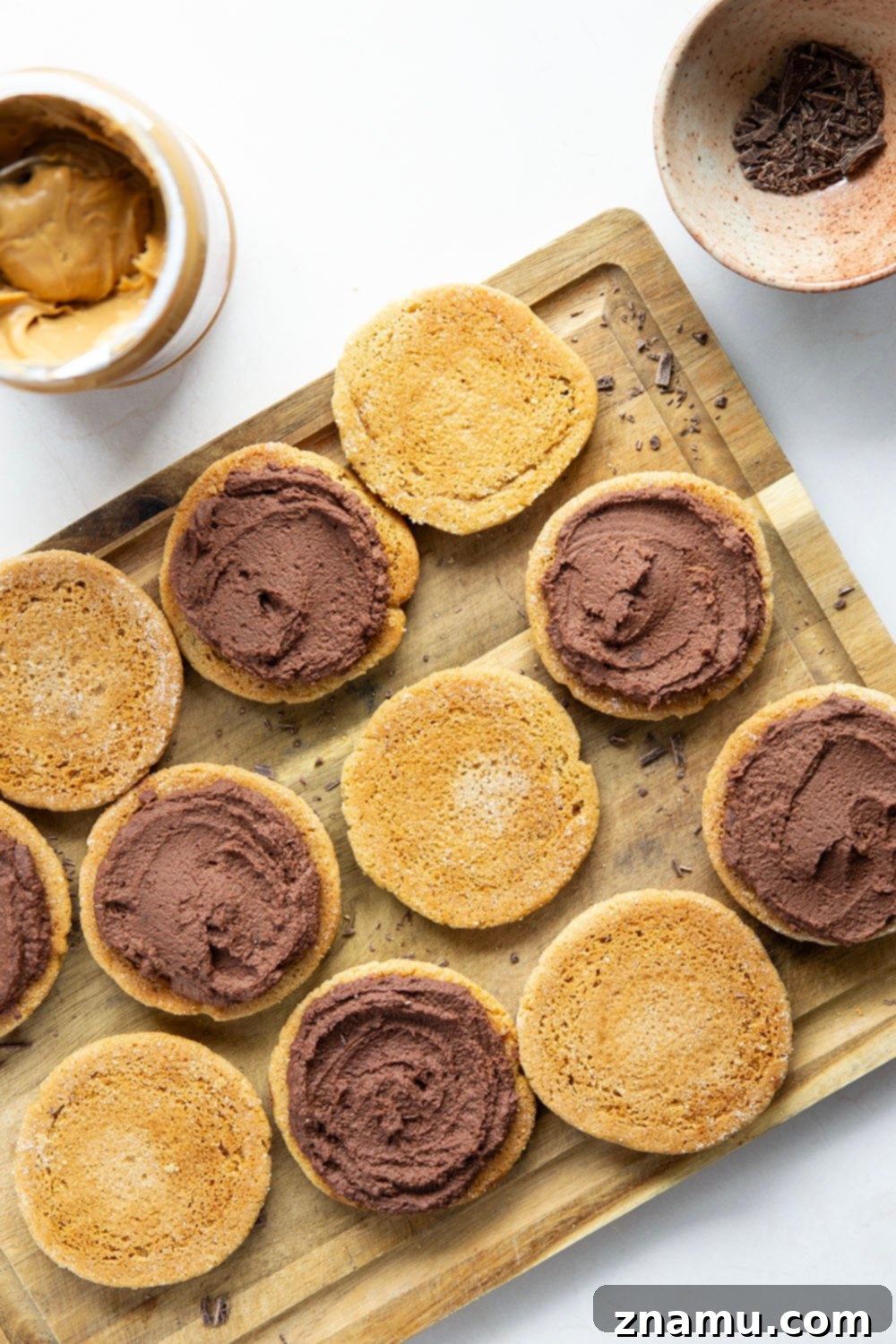 Close-up of a chocolate peanut butter sandwich cookie showing the filling