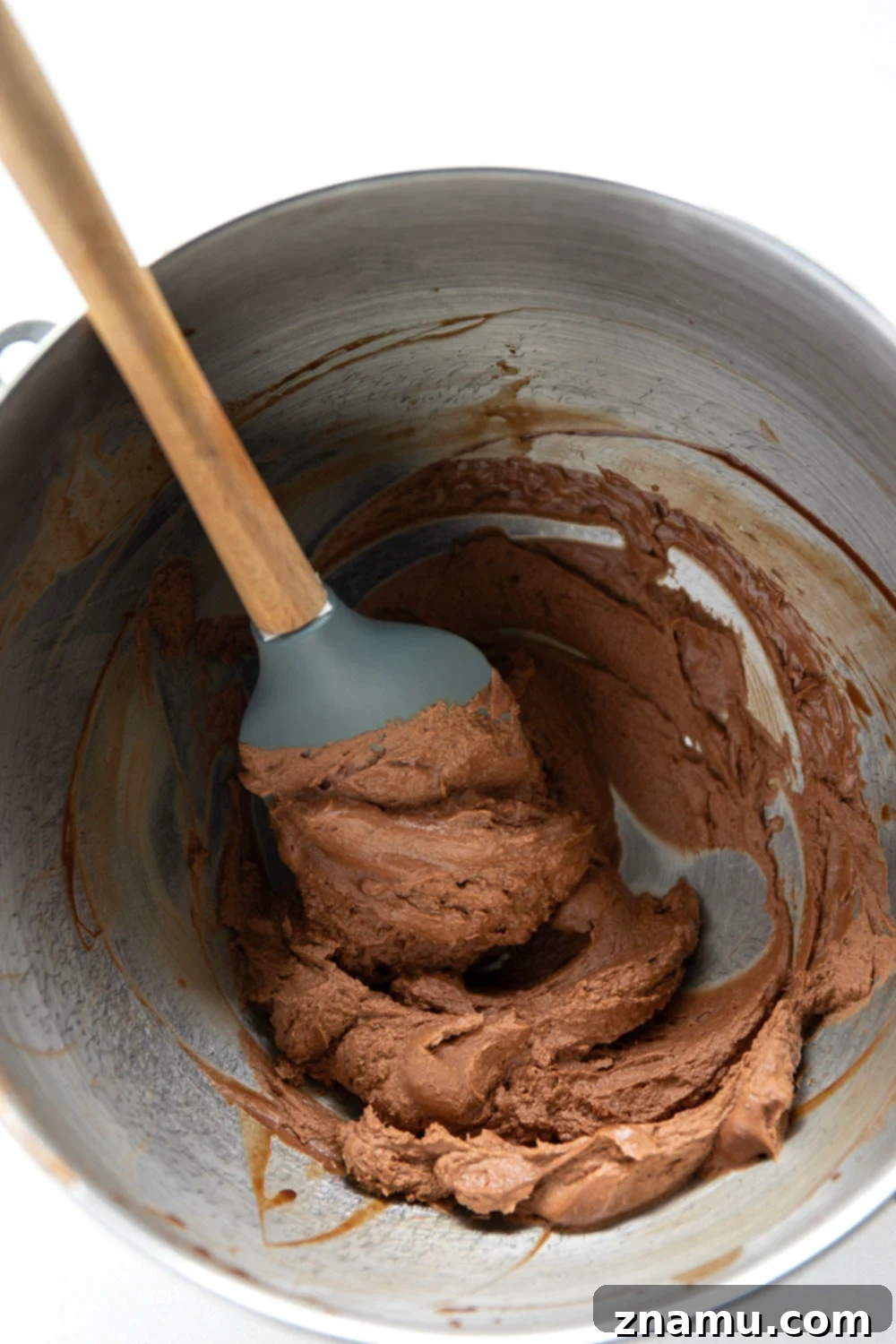 Stacked chocolate peanut butter sandwich cookies with a bite taken out