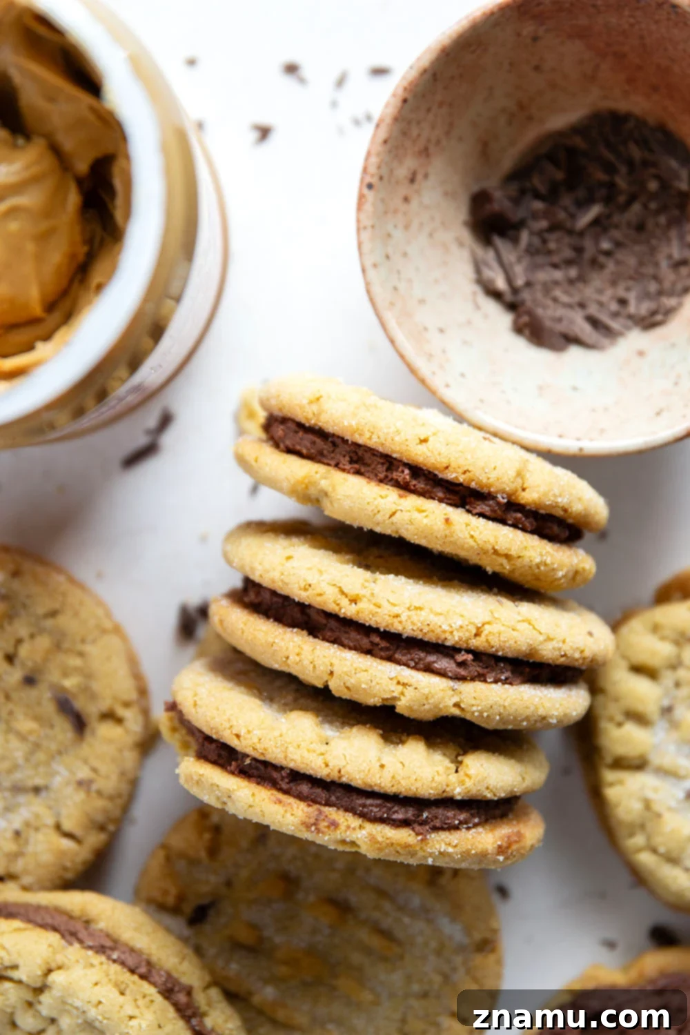 Various chocolate peanut butter sandwich cookies arranged on a plate
